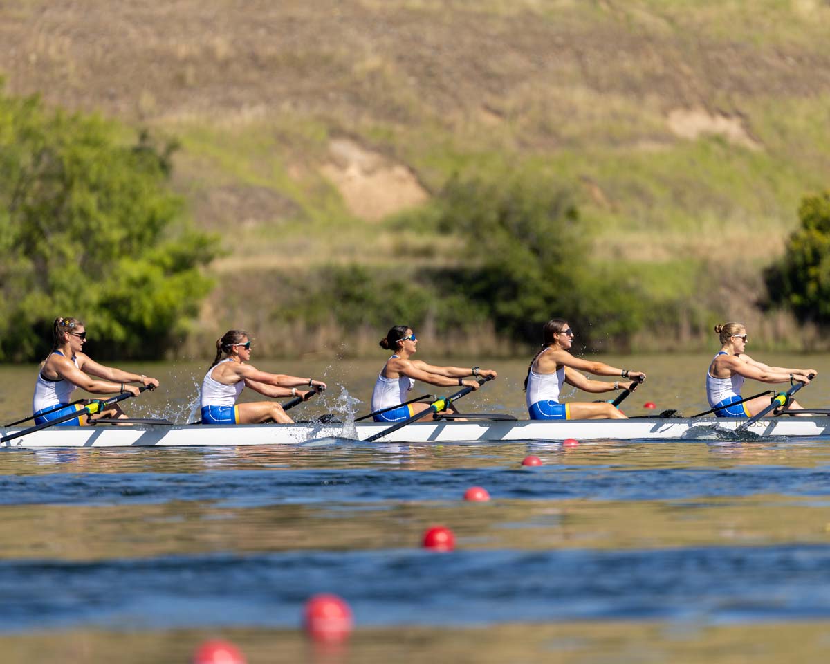 women's rowing team preparing their boats
