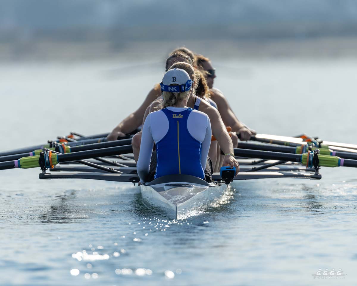 women's rowing team practicing on the water