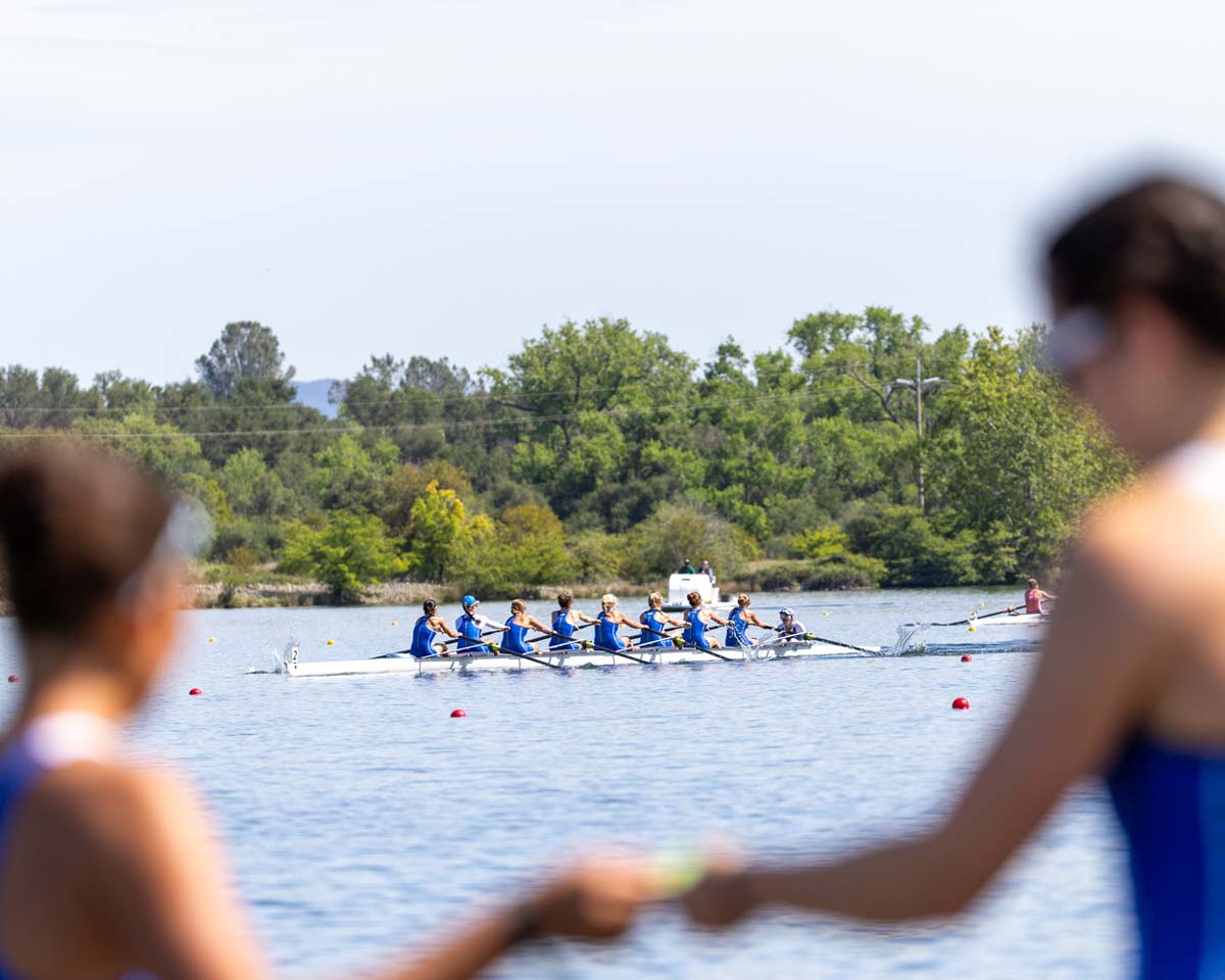 women's rowing competing on the water