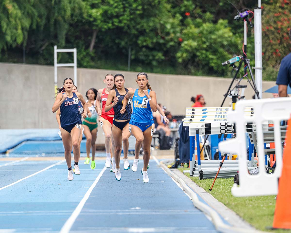 women's track runner running ahead of the pack